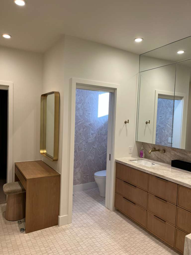 Staircase landing with clean white walls and window trim
